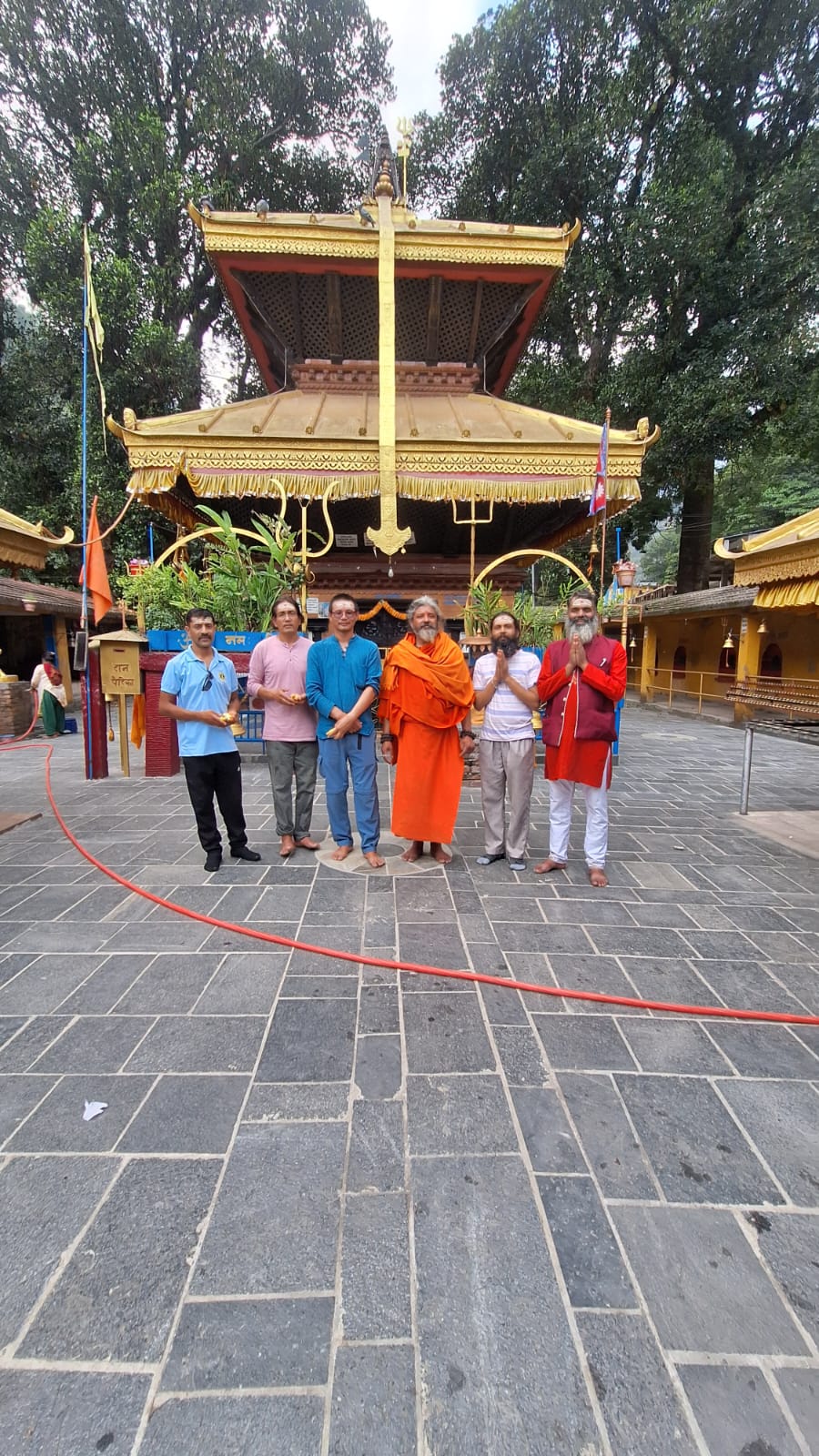 Arjuna with students at a temple gate during a yoga pilgrimage in Nepal