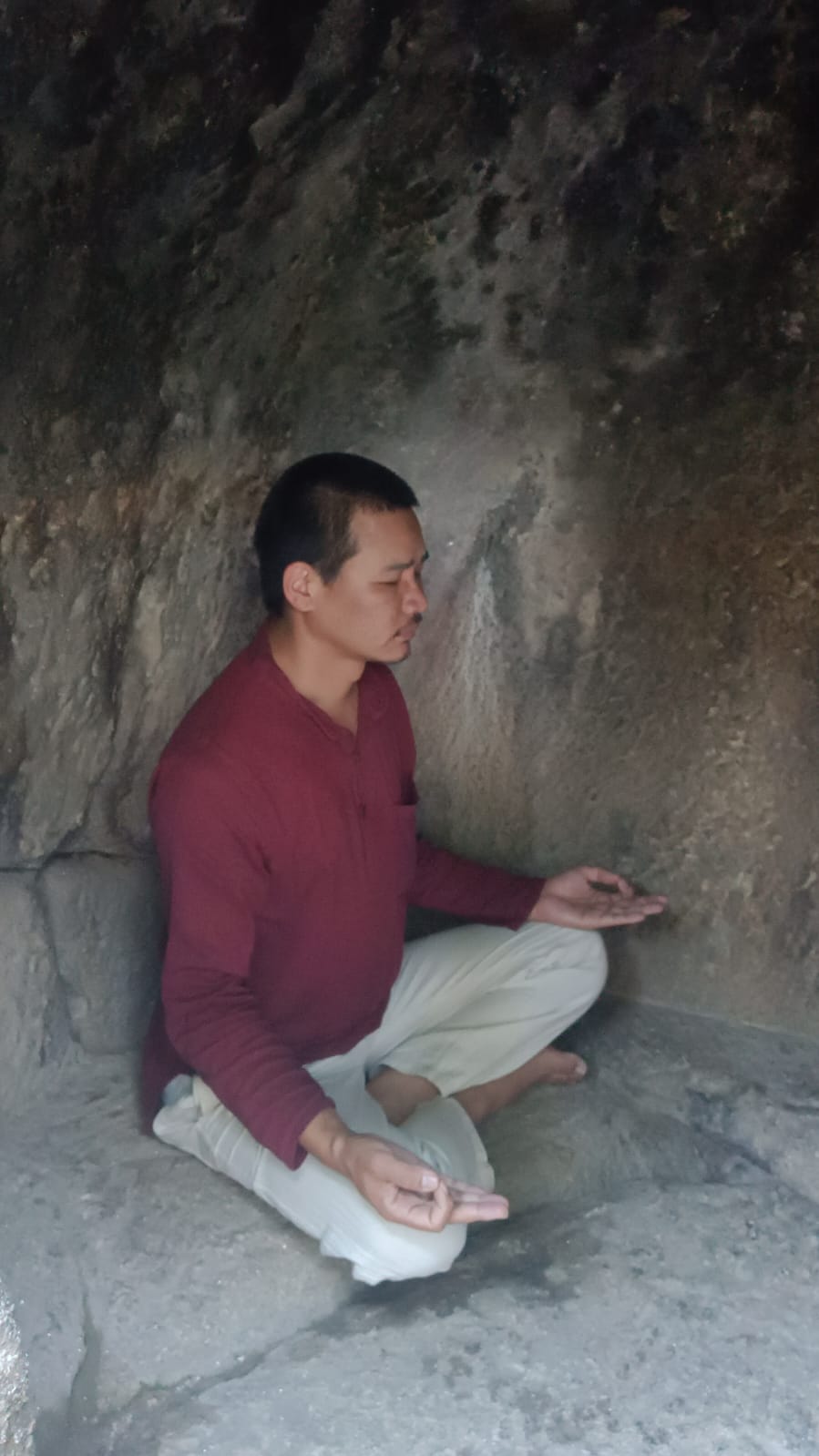 Yogi meditating inside a Himalayan cave in Nepal