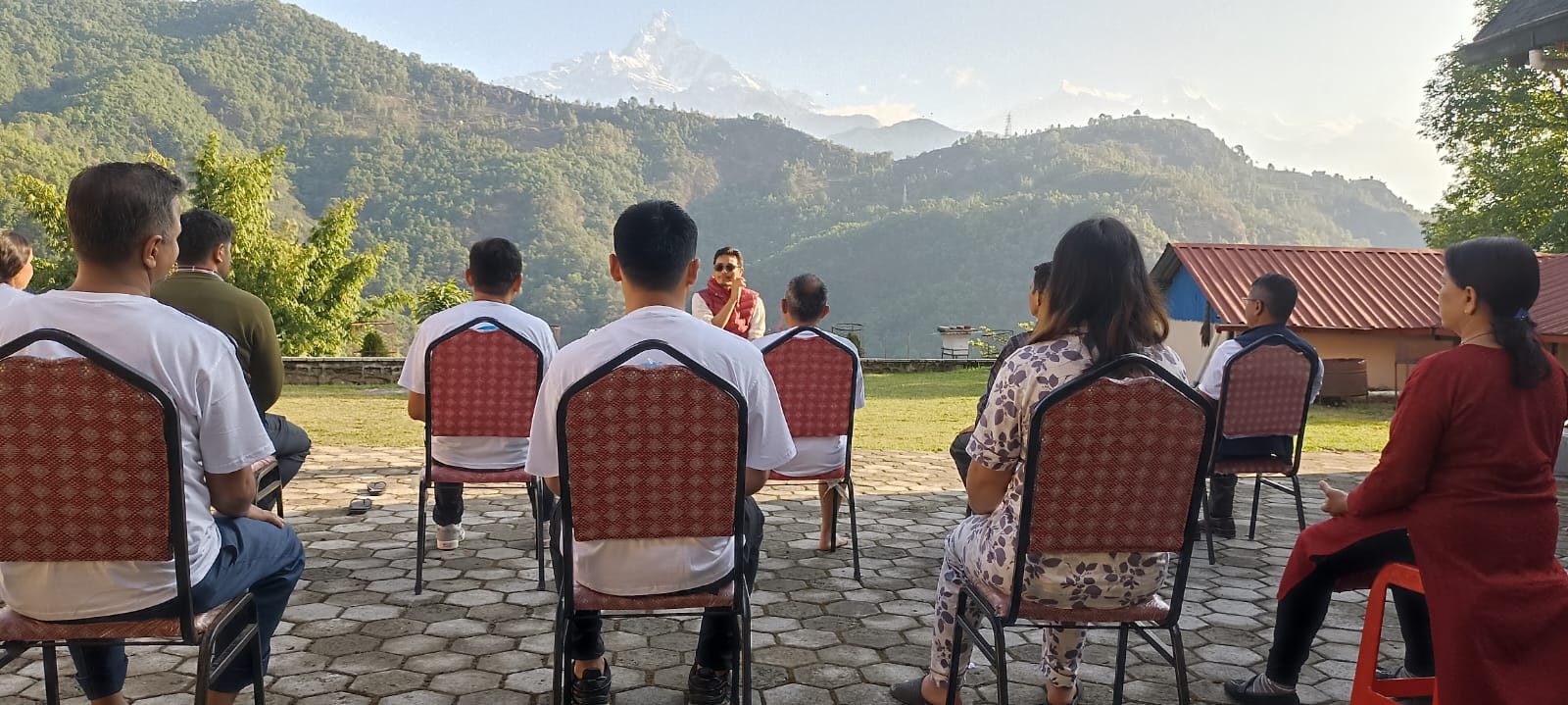 Outdoor meditation session facing the Himalayan foothills on a Yogmandu retreat