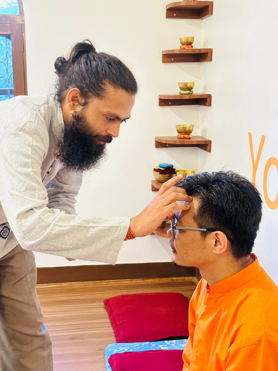 Traditional tilak blessing ceremony in the guru-shishya yoga tradition, Nepal