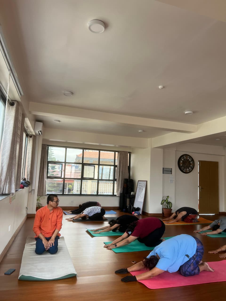 Morning Hatha yoga class on mats at Yogmandu studio in Kathmandu, Nepal