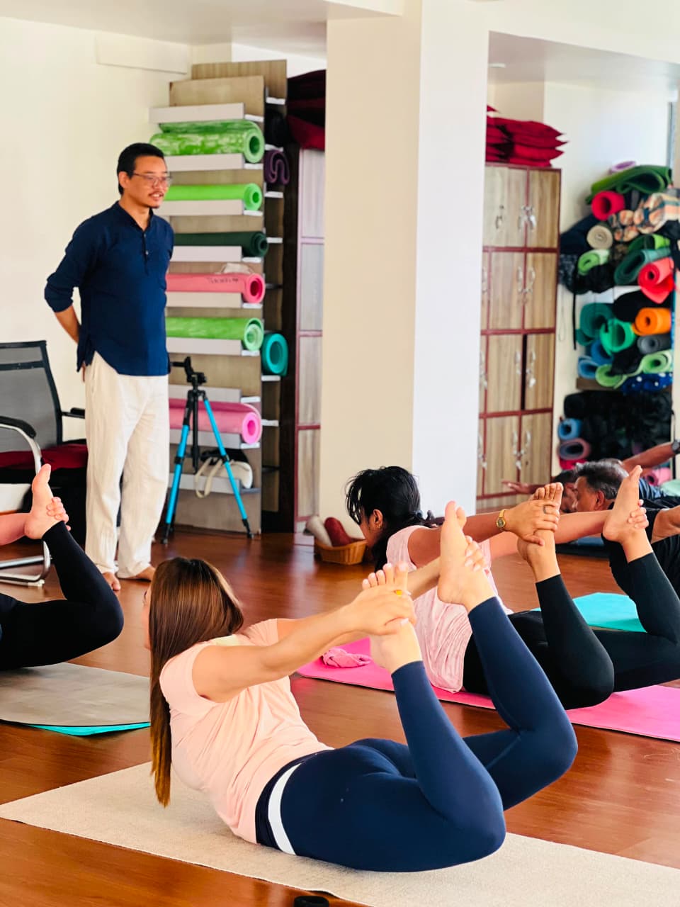 Teacher guiding a yoga and breathwork class at Yogmandu studio, Kathmandu