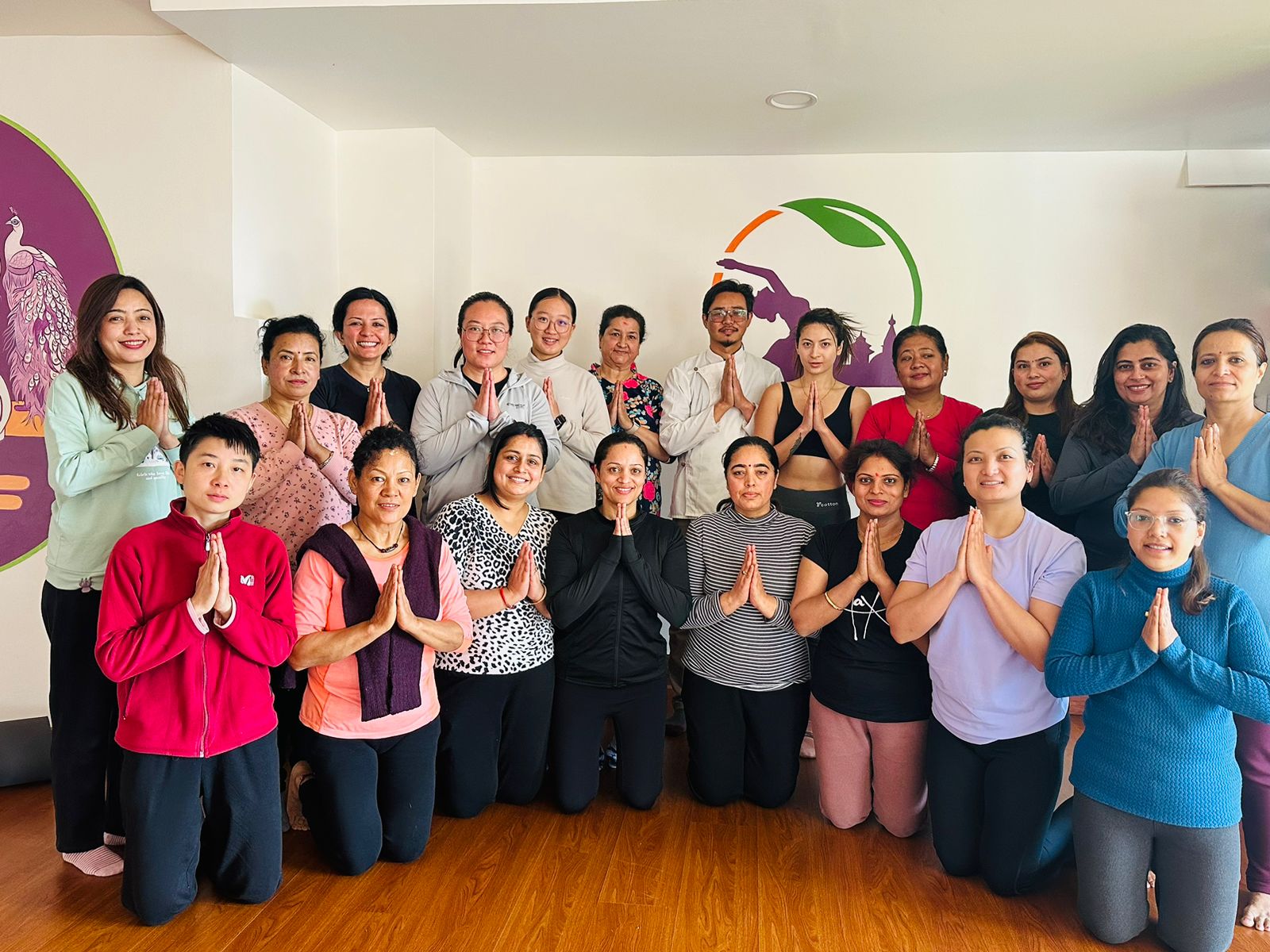 Group of students in namaste at Yogmandu yoga studio, Kathmandu, Nepal